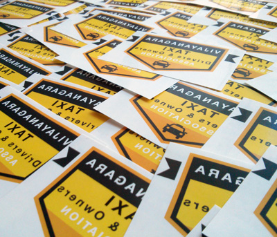 Vijayanagara Taxi Association Stickers Spread Across.